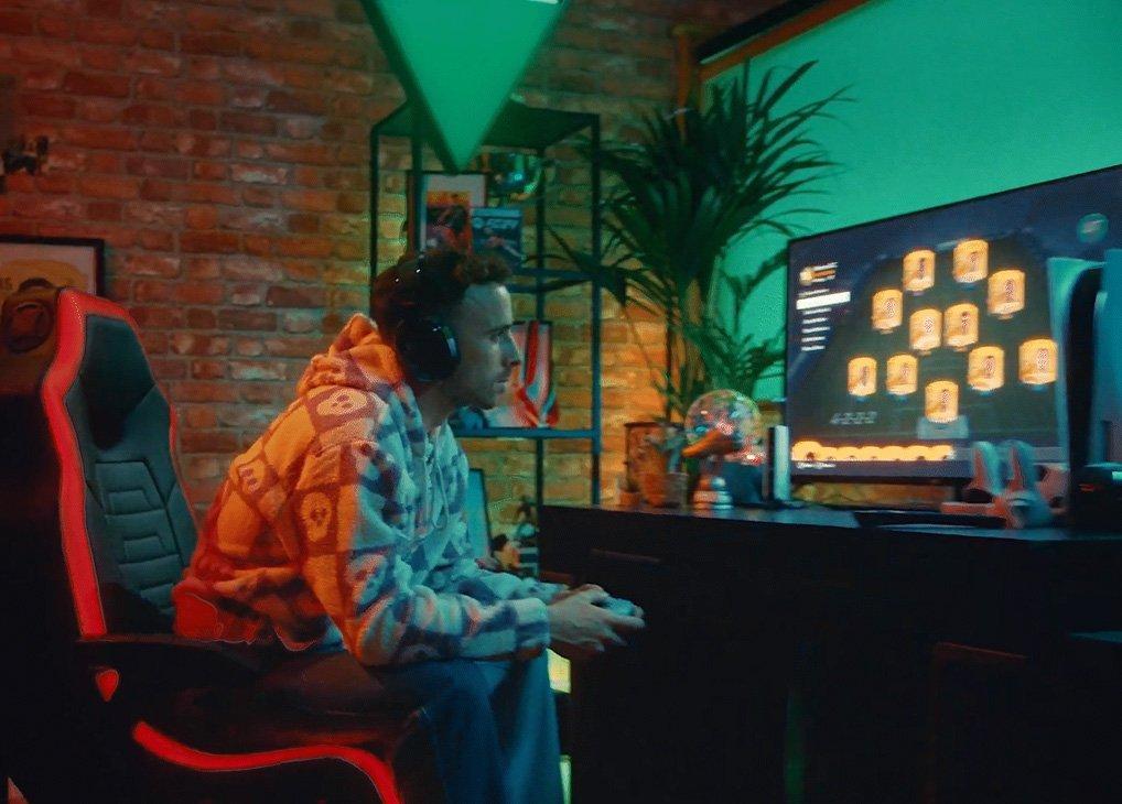 man in a gaming chair in motion leaning forward in his gaming chair